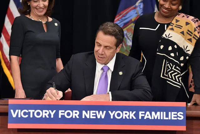 Governor Andrew Cuomo signs the first phase of Paid Family Leave in 2016.